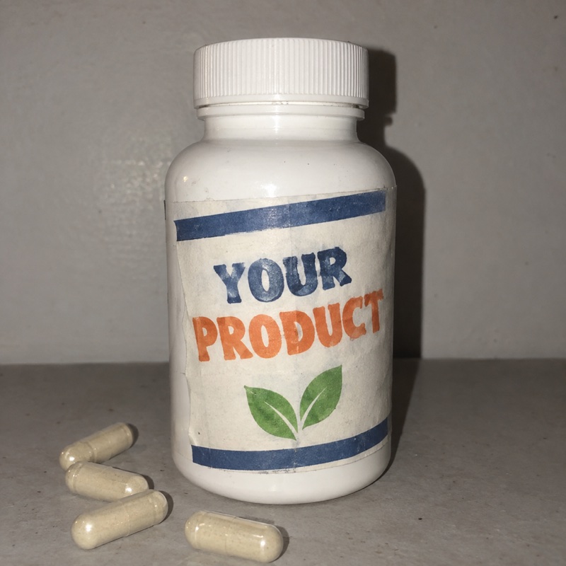 A cheap copycat bottle with a crooked label reading Your Product