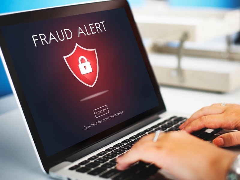 A fraud alert on a laptop screen